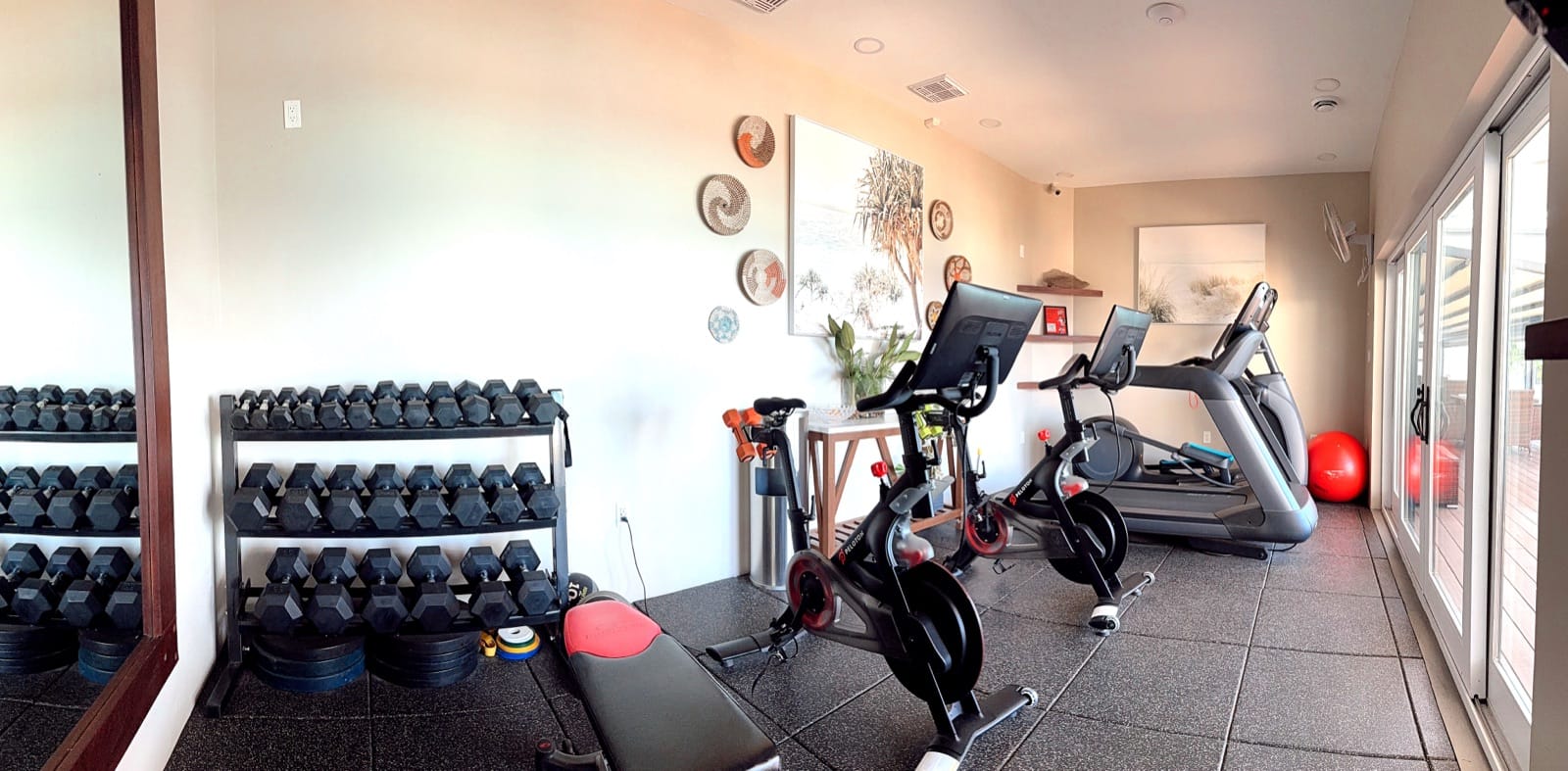 The fitness center with cardio equipment and free weights