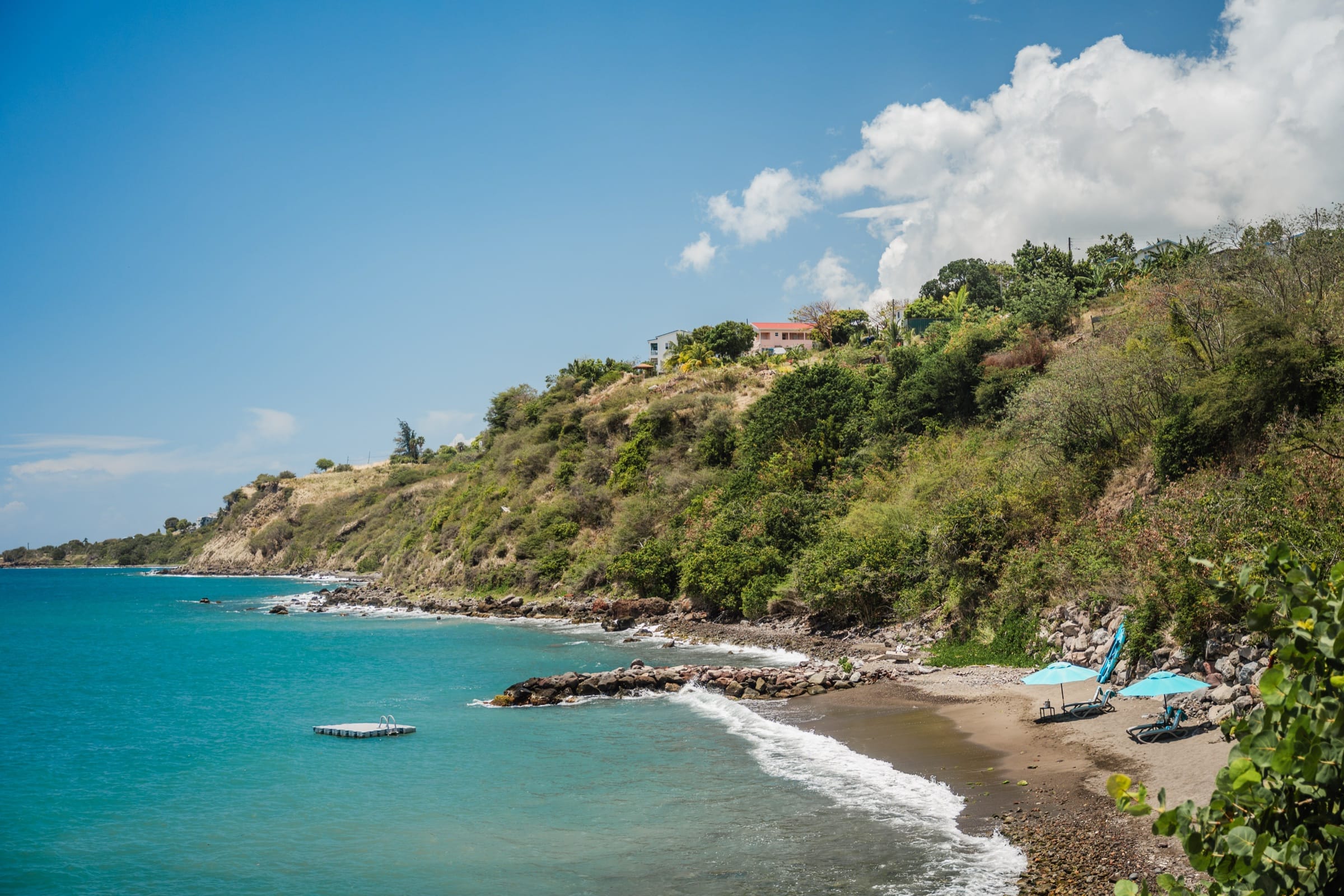 Aerial view of the private beach cove below the resort